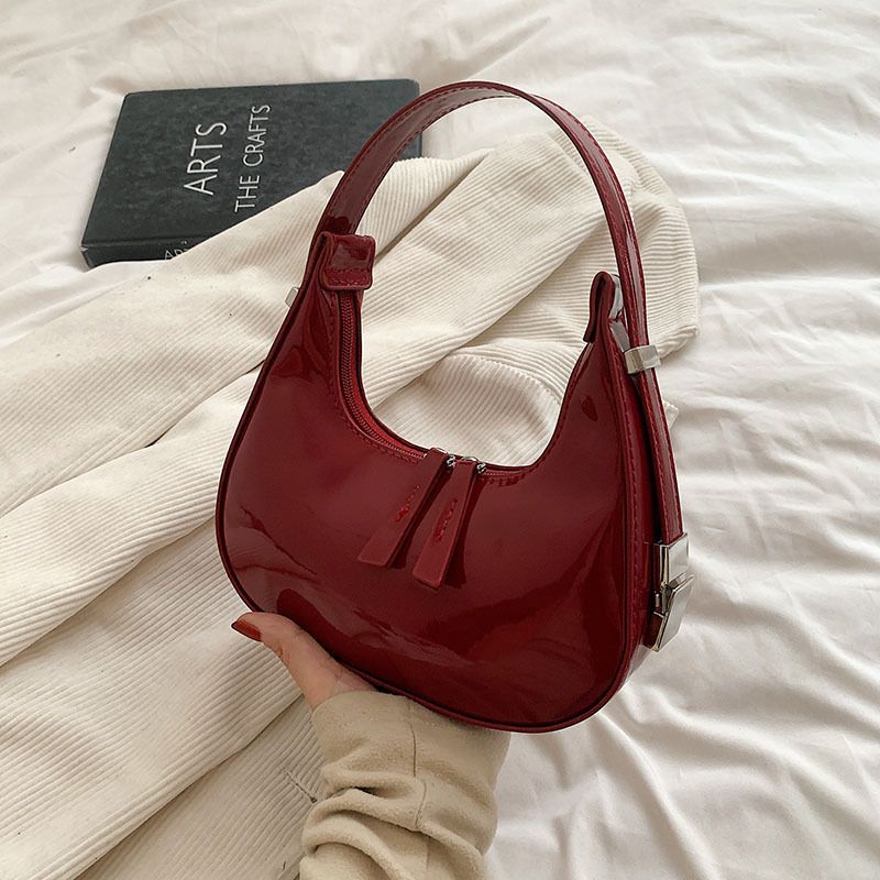Sacs à bandoulière en cuir verni Scilla