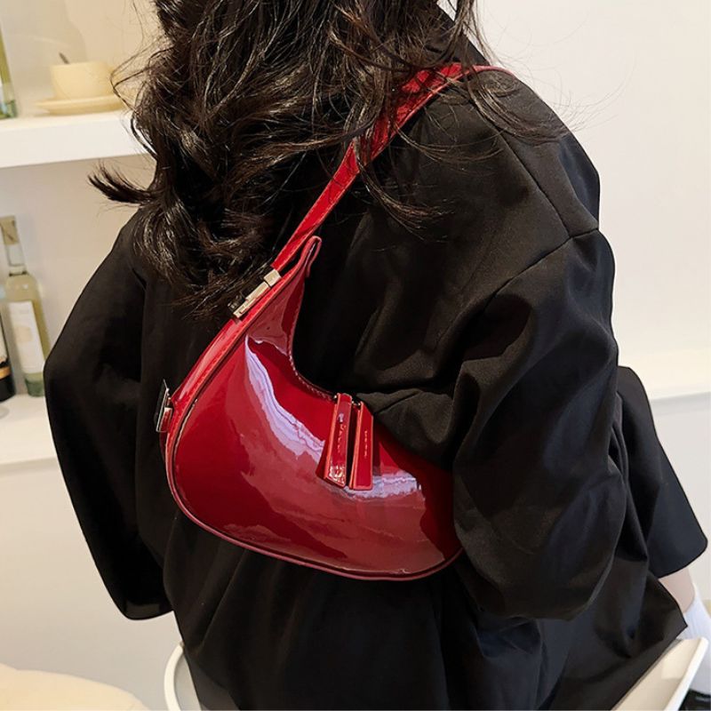 Sacs à bandoulière en cuir verni Scilla
